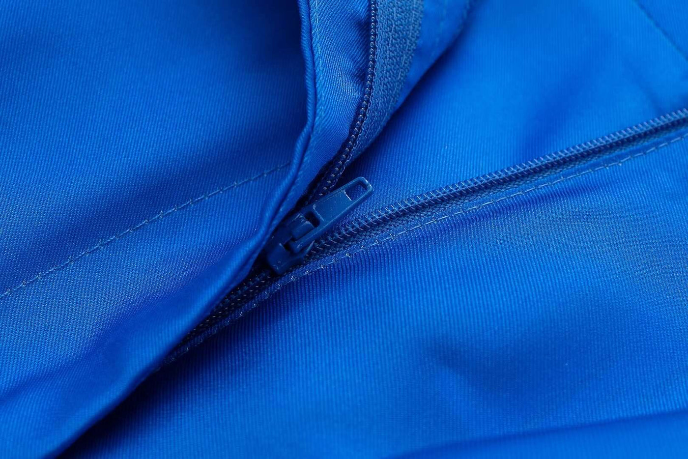 a close up of a blue shirt with a blue tie 