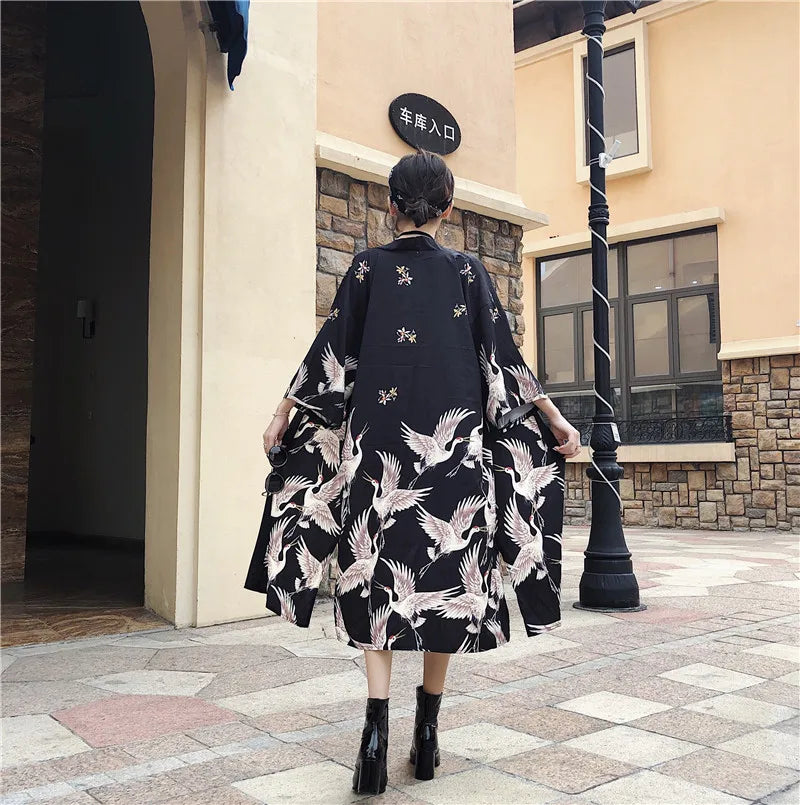 a woman walking down the street with a handbag 