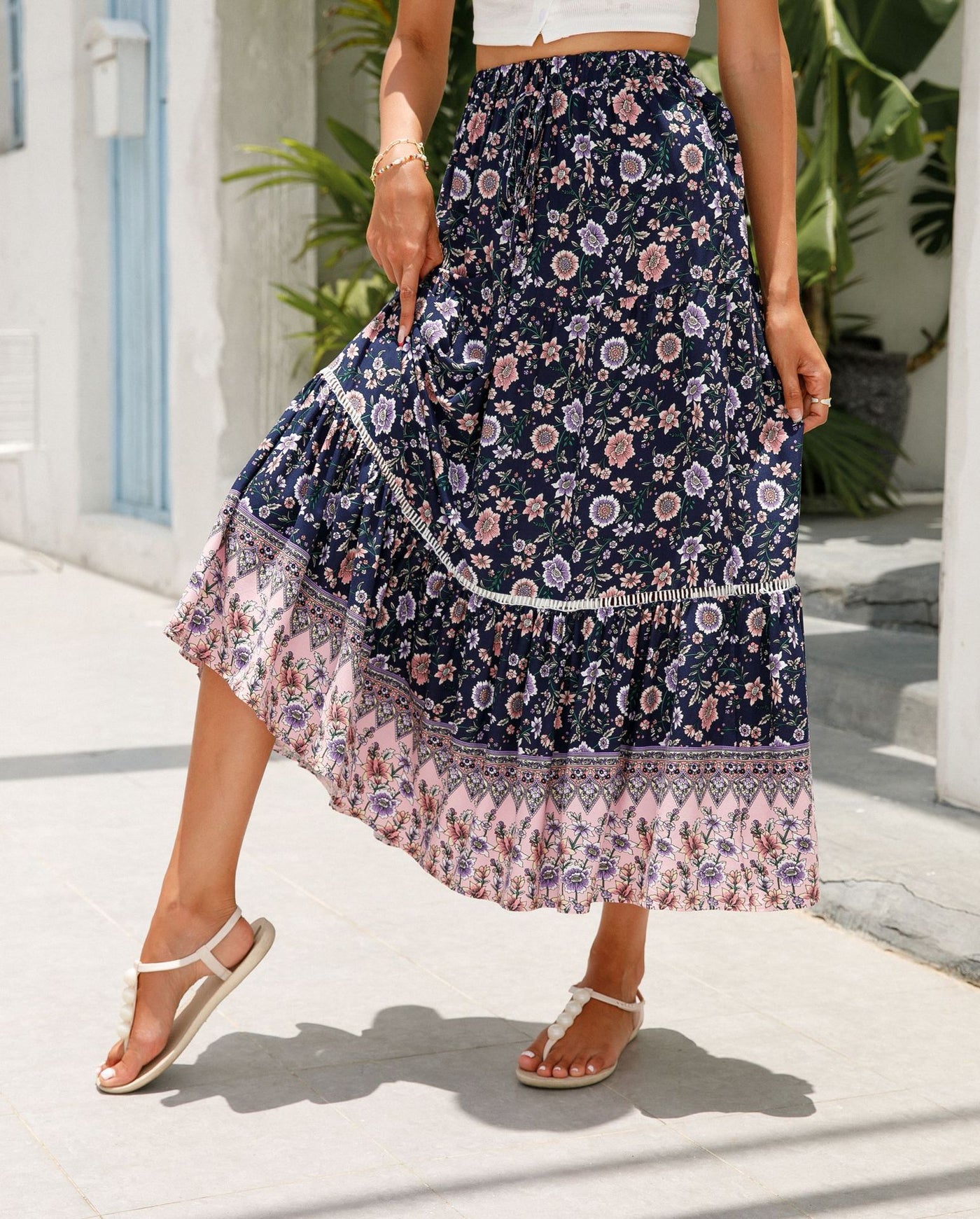 a woman in a dress holding an umbrella 