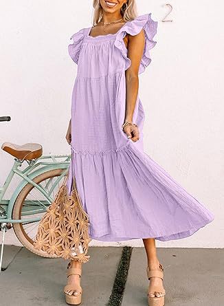 a girl in a pink dress holding a pink umbrella 