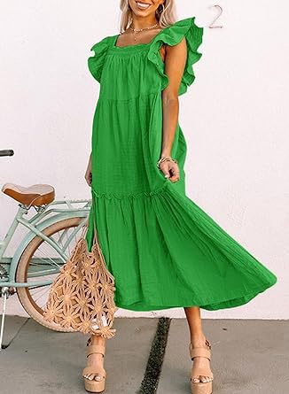 a woman in a green dress holding a green umbrella 