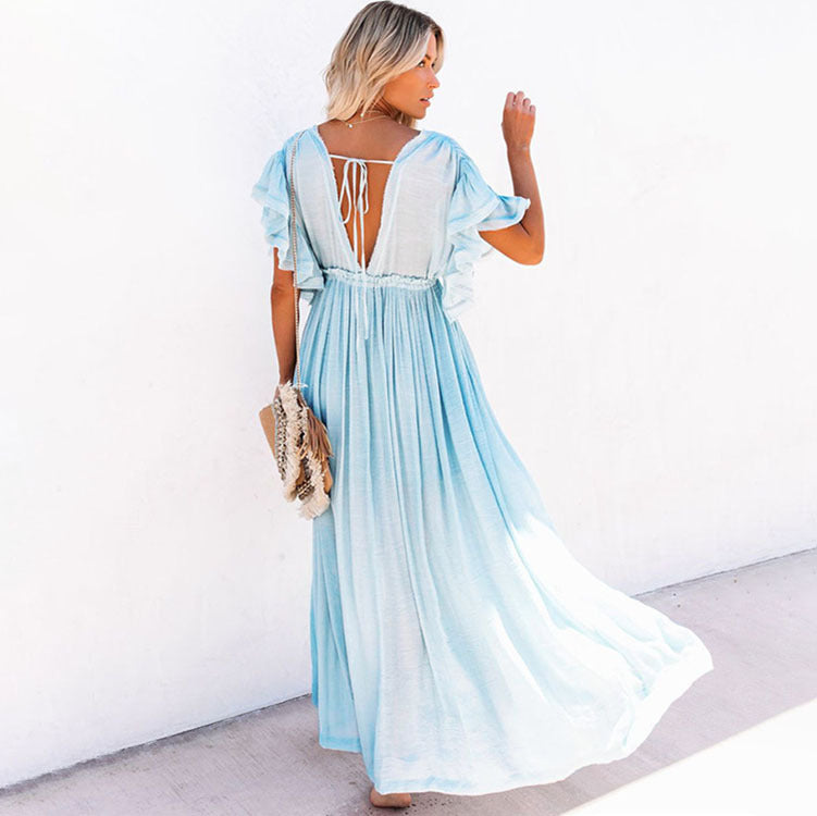 a woman in a white dress holding a toothbrush 