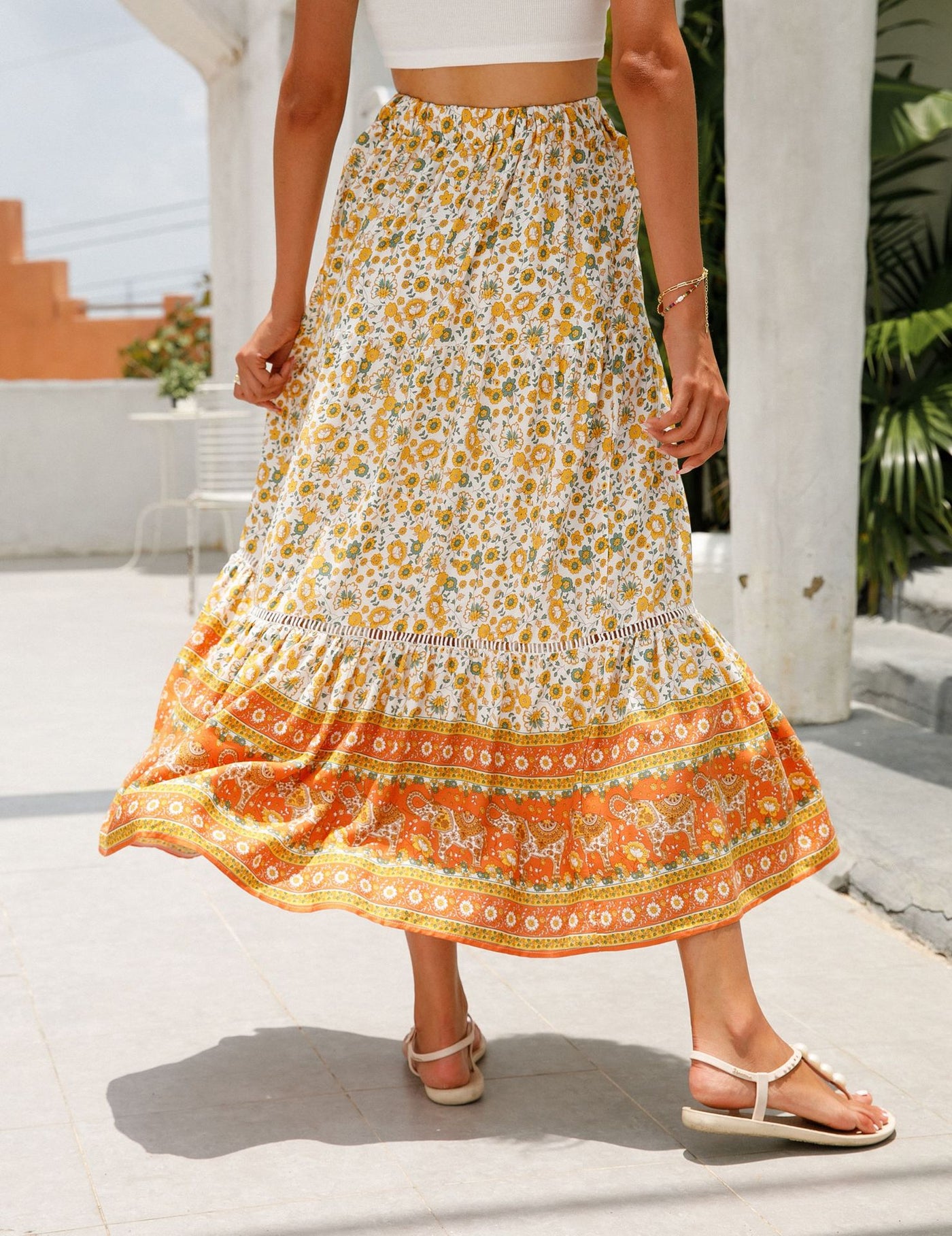 a woman in a dress holding an umbrella 