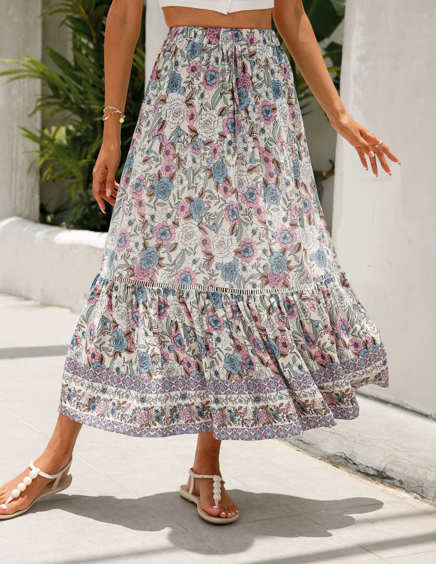 a woman in a dress holding an umbrella 