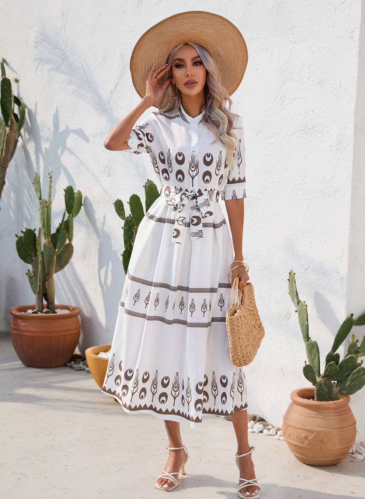 a woman in a white dress holding an umbrella 