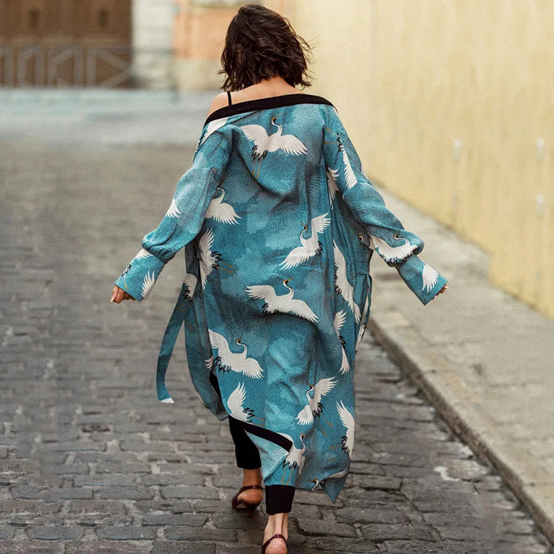 a woman walking down a street carrying a bag 