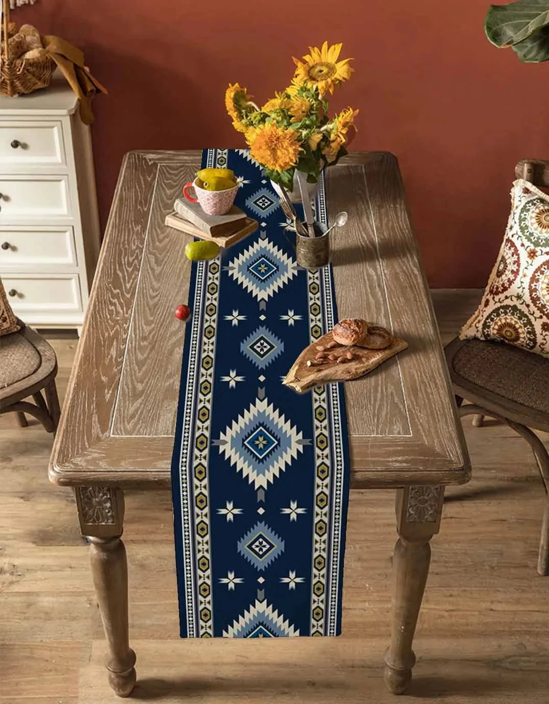 a vase with flowers on a wooden table 